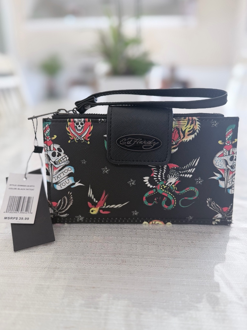 Ed Hardy Black Tattoo-Print Wristlet with Multicolor Motifs